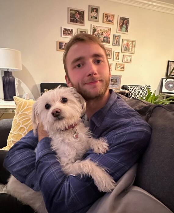 Jake Armstrong holding a puppy