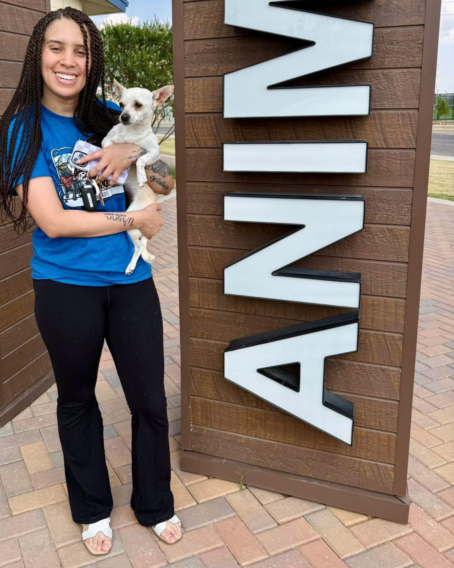 woman holding a puppy